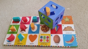The Playskool Form Fitter helps the shapes in the Bright Baby Big Board Book come to life!